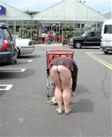 Great Grab Of A Female Shopper Bending Down In A Public Car Park