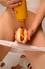 Naked Girl Squirts Mustard Onto Hot Dog Front Her Bald Pussy